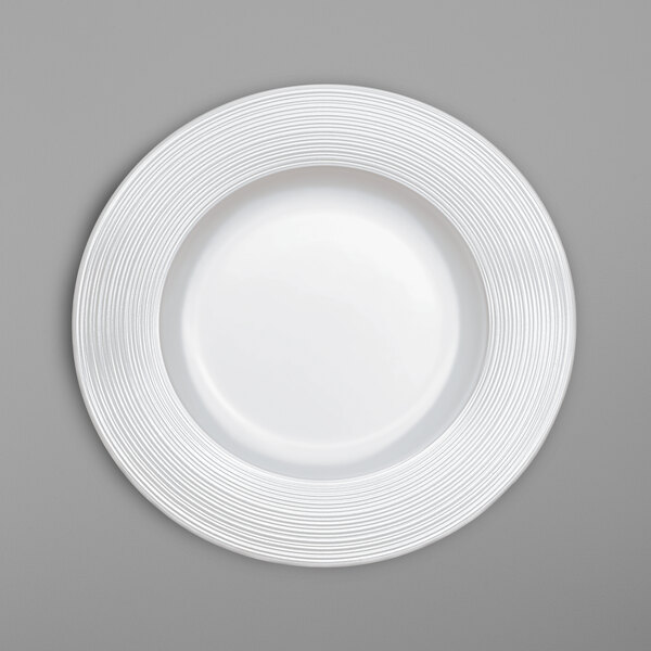 A white Villeroy & Boch bone porcelain plate with a spiral pattern on the rim.