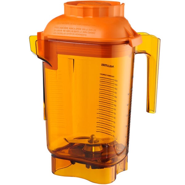 An orange Vitamix blender jar with a lid and handle.