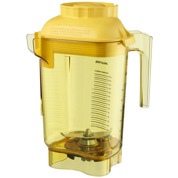 A yellow Vitamix blender with a yellow lid on it.