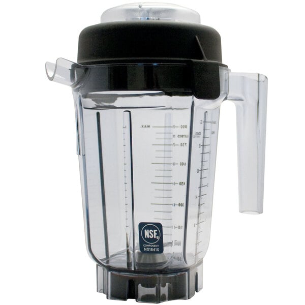 A clear plastic Vitamix blender jar with a black lid on it.