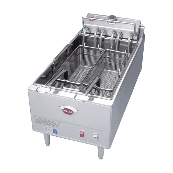 A Wells electric countertop fryer with several baskets.