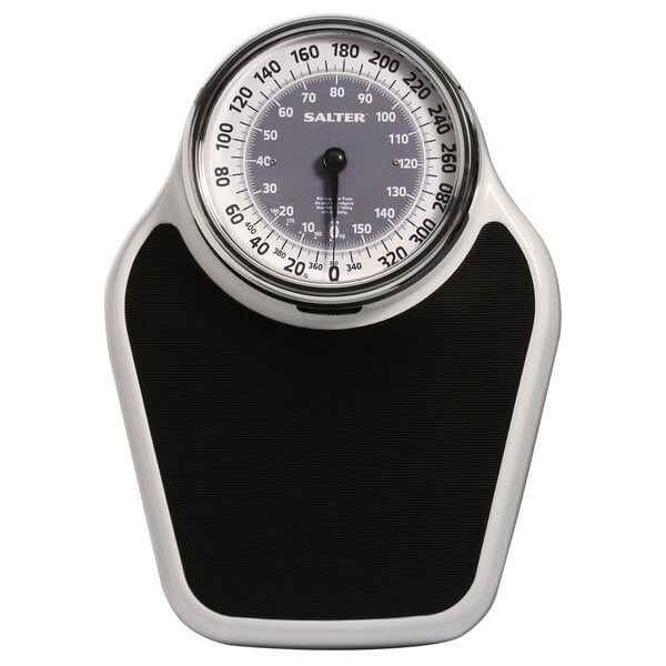 A close-up of a Taylor white and black analog bathroom scale with a speedometer design.