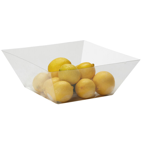 A clear plastic container holding lemons.