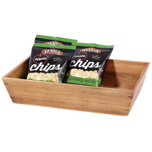 A GET Urban Renewal rectangular wood tray with bags of chips on a table.