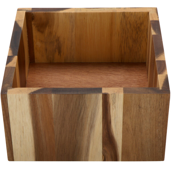 A wooden box with a square wood surface on a table.