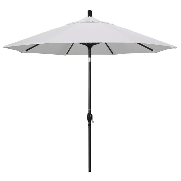 A white umbrella with a stone black pole.