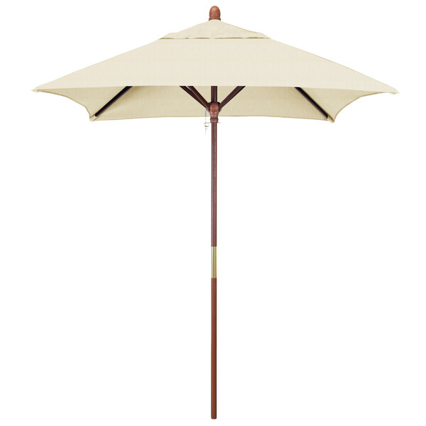 A white California Umbrella with a wooden pole.