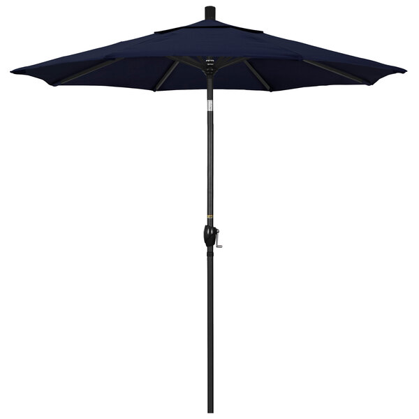 A navy California Umbrella on a stone black pole.