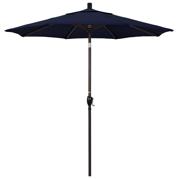 A California Umbrella Pacific Trail navy blue umbrella on a bronze pole.