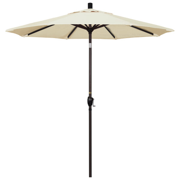 A white umbrella with a bronze pole.