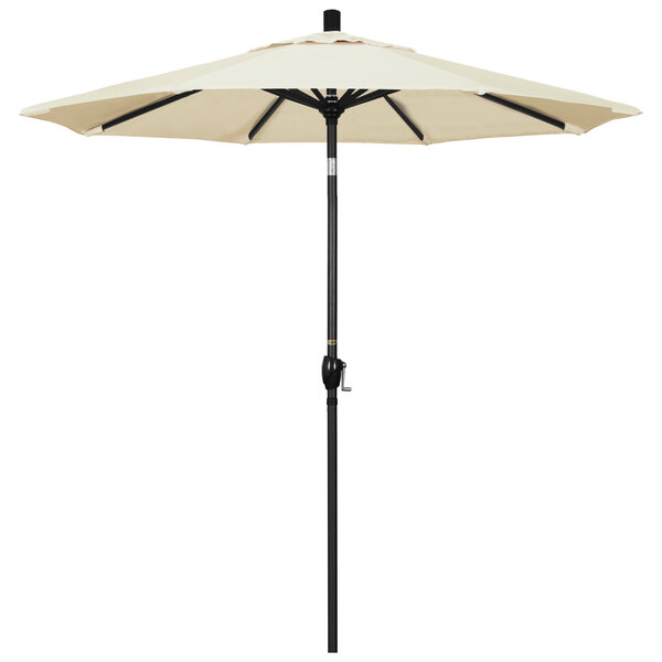A white umbrella with a black pole.