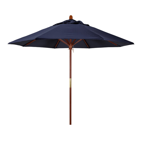 A blue California Umbrella with a wooden pole and Sunbrella navy fabric canopy.