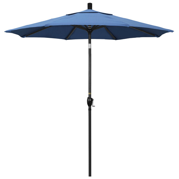 A blue California Umbrella on a black pole.