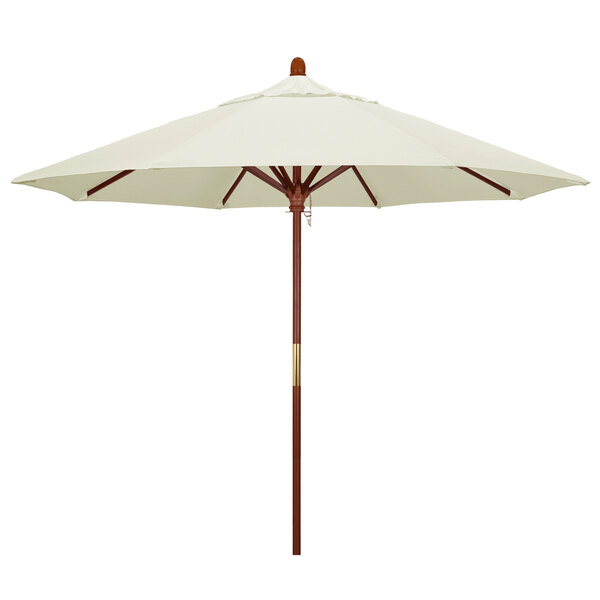 A California Umbrella Pacifica Grove outdoor umbrella with a white canopy and brown pole.