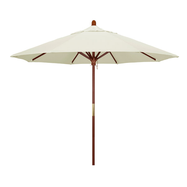 A California Umbrella with a white Sunbrella canopy and a brown hardwood pole.
