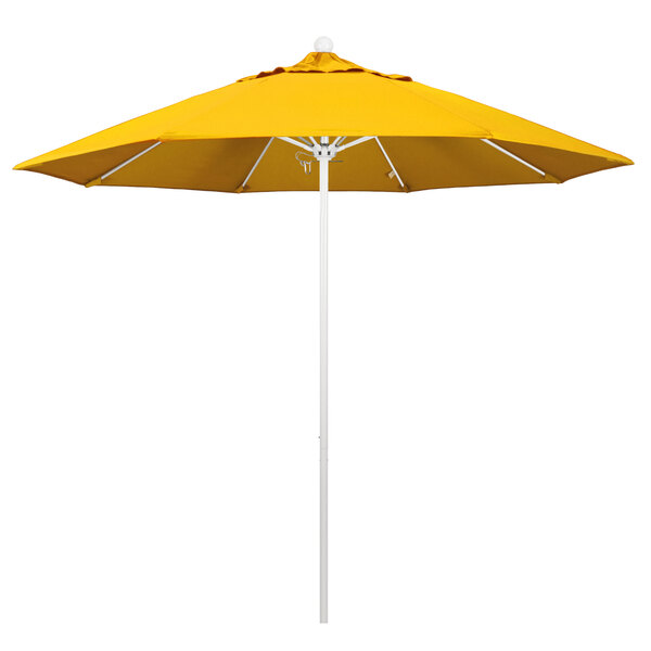 A close-up of a yellow California Umbrella on a white pole.