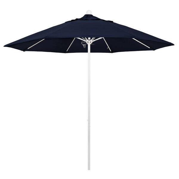 A close-up of a California Umbrella with a navy blue Sunbrella canopy.