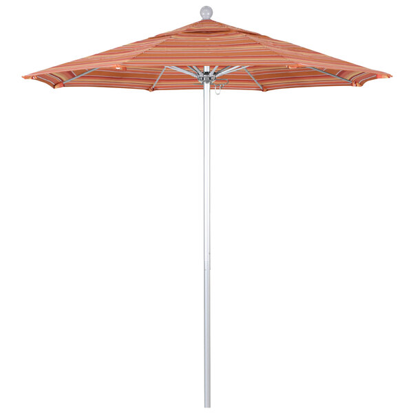A California Umbrella ALTO round outdoor umbrella with a striped Dolce Mango canopy on a silver metal pole.