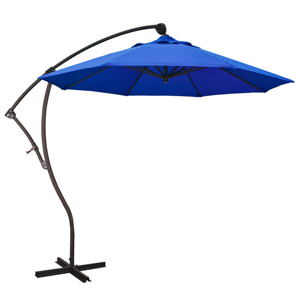 A California Umbrella Bayside cantilever umbrella with a blue Pacifica canopy on a white background.