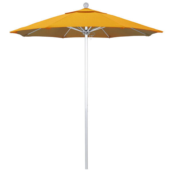 A close-up of a yellow California Umbrella with a silver pole.