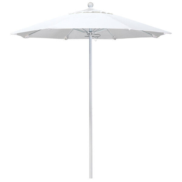 A white California Umbrella on a white pole.