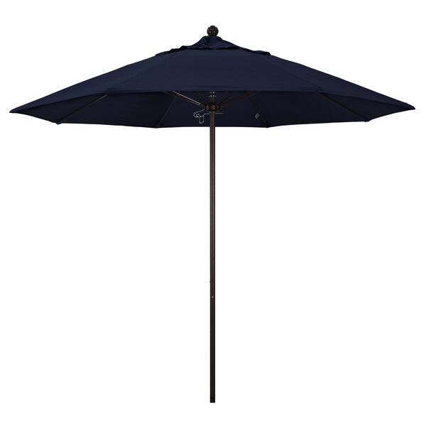 A California Umbrella ALTO round outdoor umbrella with a navy blue Sunbrella canopy.
