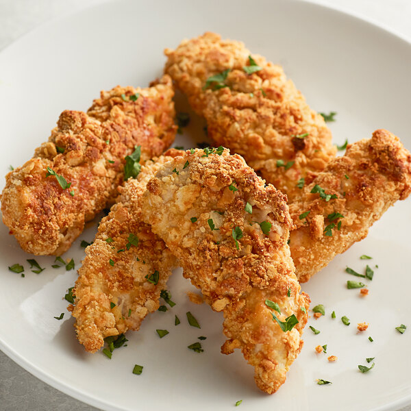 A plate of fried chicken strips coated with Nabisco Ritz bread crumbs.
