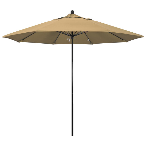 A tan California Umbrella with a champagne pole on a pole.