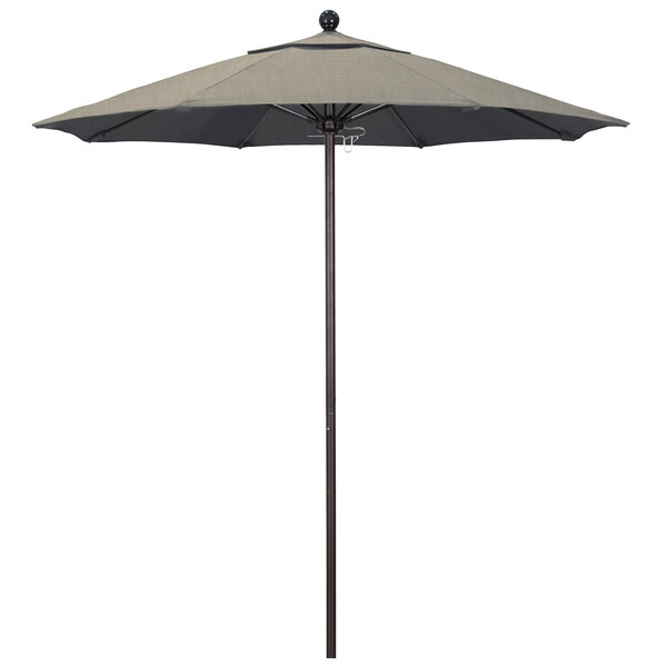 A California Umbrella ALTO round outdoor umbrella with a bronze pole and beige Sunbrella canopy.