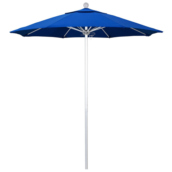 A blue California Umbrella on a white pole.