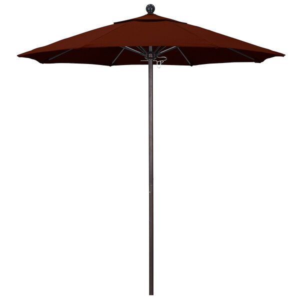 A brown California Umbrella on a bronze metal pole with a Pacifica brick red canopy.