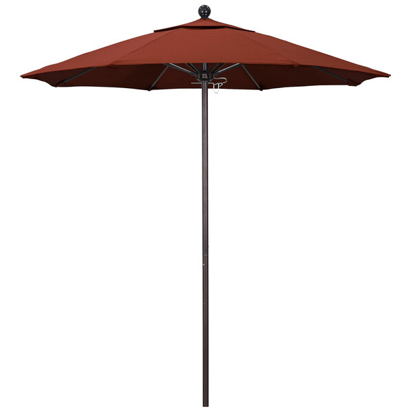 A red California Umbrella on a bronze pole with a terracotta canopy.