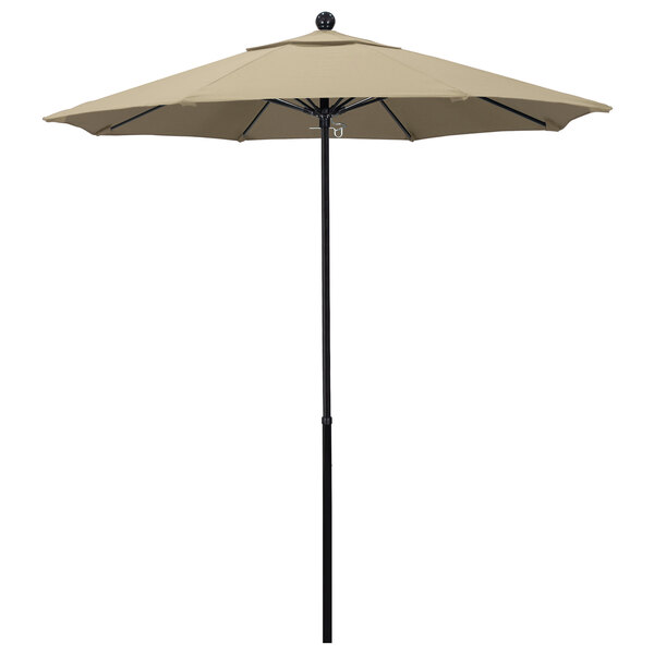 A California Umbrella with a beige Pacifica canopy on a fiberglass pole.