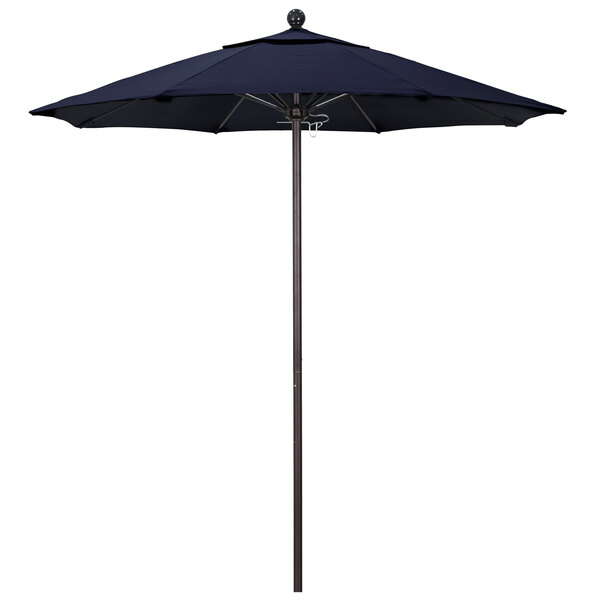 A navy blue California Umbrella with a bronze pole.