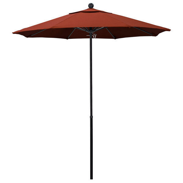 A red California Umbrella with Sunbrella terracotta fabric on a black pole.