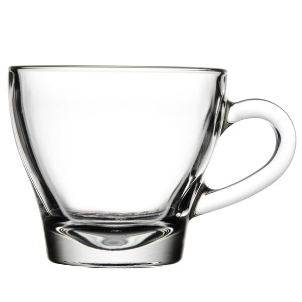 A Libbey clear glass cappuccino cup with a handle.