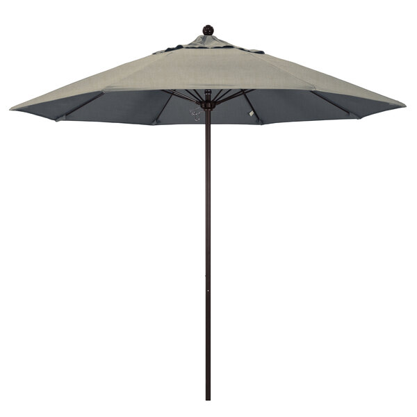 A California Umbrella ALTO round umbrella with a bronze pole and grey Sunbrella canopy.
