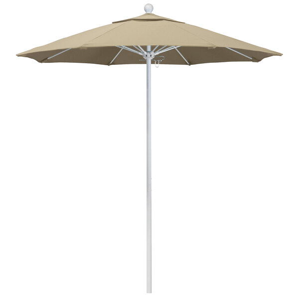 A close-up of a beige California Umbrella on a white pole.