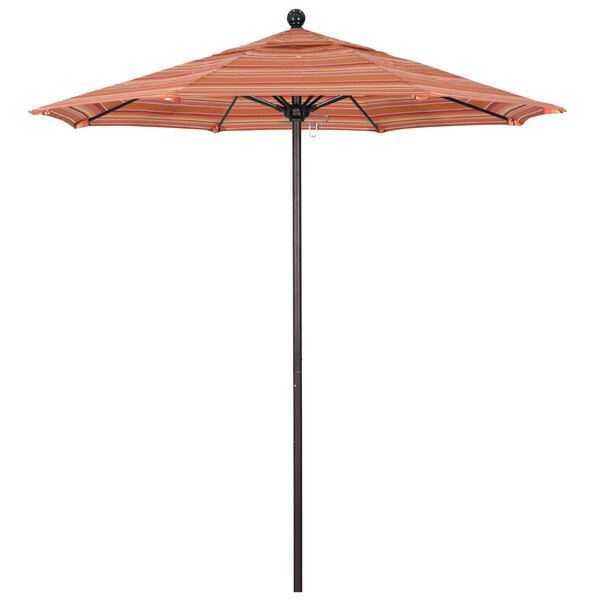 A California Umbrella round outdoor umbrella with a striped orange and black Sunbrella canopy on a bronze pole.