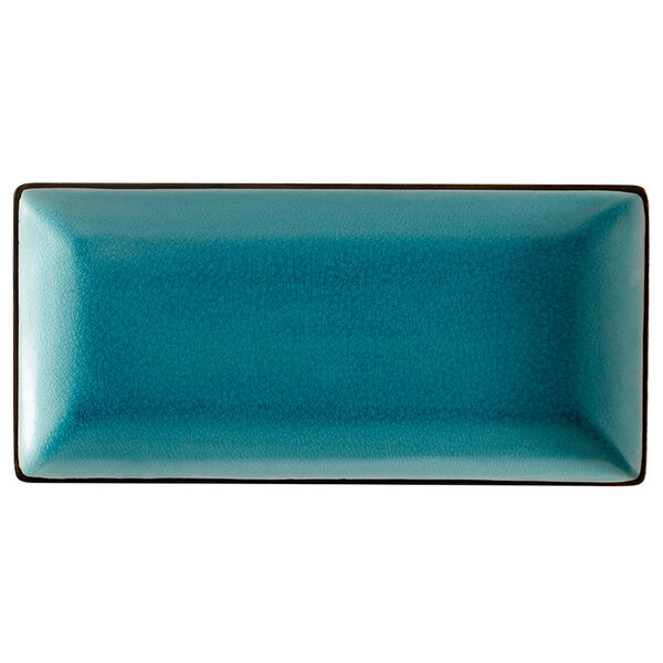 A blue rectangular CAC stoneware plate with black edges.