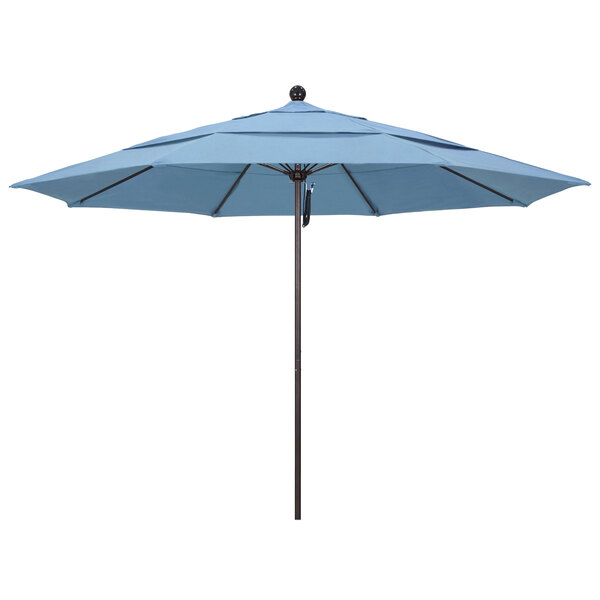 A close-up of a blue California Umbrella with a bronze pole.