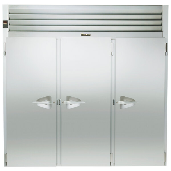 The stainless steel solid door of a Traulsen roll-in refrigerator.