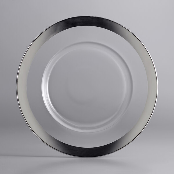 A white glass charger plate with a silver rim.