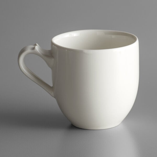 A white RAK Porcelain cappuccino cup with a handle.