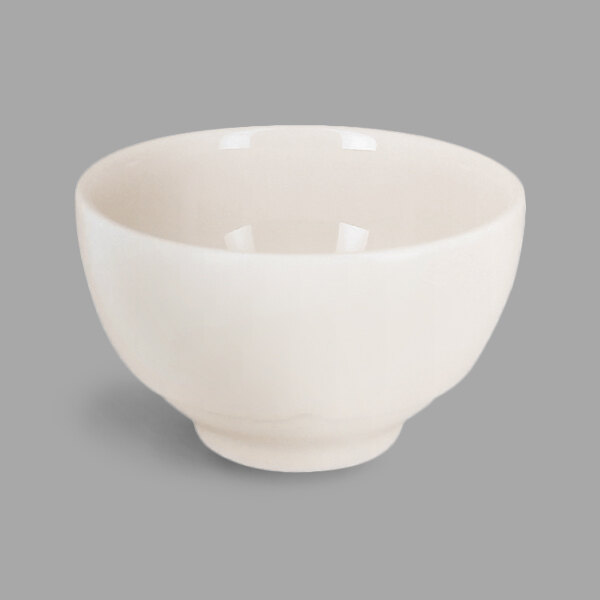 A RAK Porcelain ivory china bowl with a small handle.