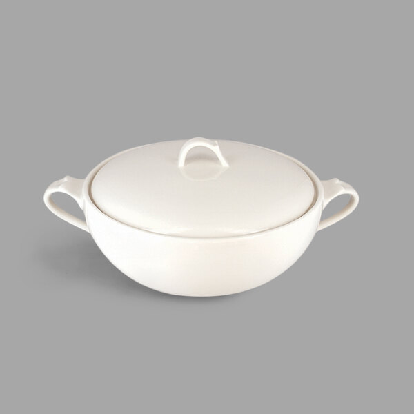 A white porcelain soup tureen with a lid and 2 handles.