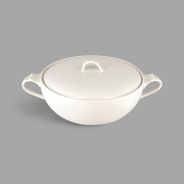 A white porcelain soup tureen with a lid and two handles.