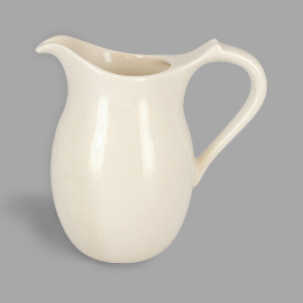 A white RAK Porcelain Anna creamer with a handle.