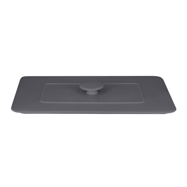 A stone gray rectangular porcelain lid with a round handle.