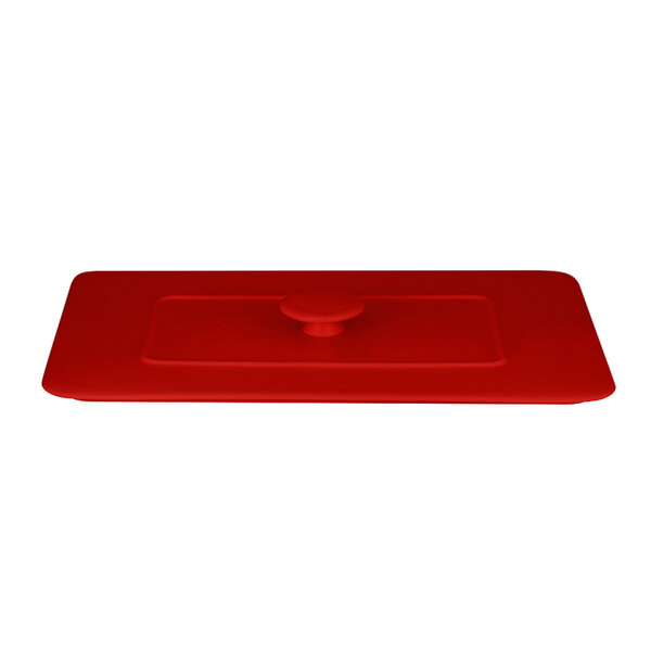 An ember red rectangular porcelain tureen lid with a red knob.